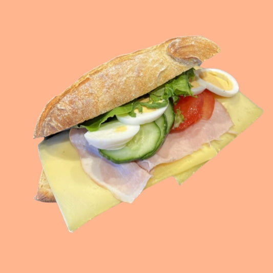 Healthy sandwich with egg, lettuce, and tomato white