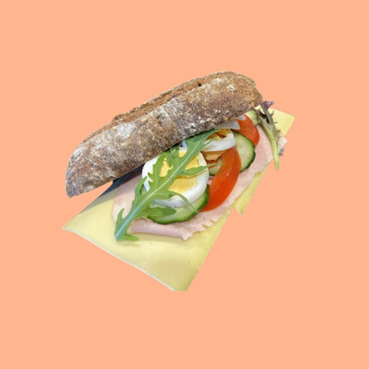 Healthy sandwich with egg, lettuce, and tomato brown